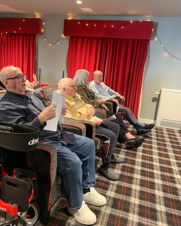 Residents Sitting In The Cinema Room