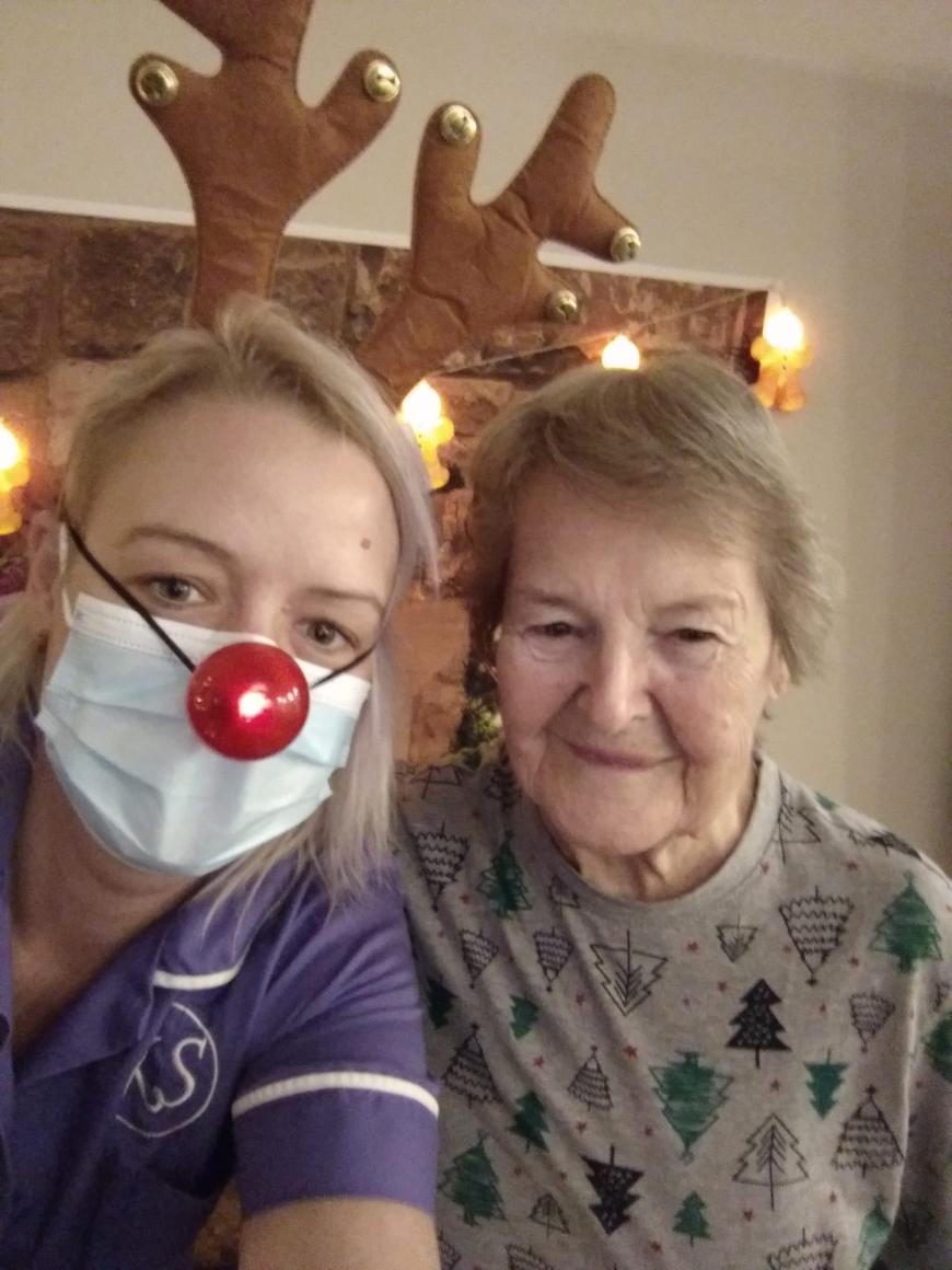 resident-and-care-assistant-at-christmas