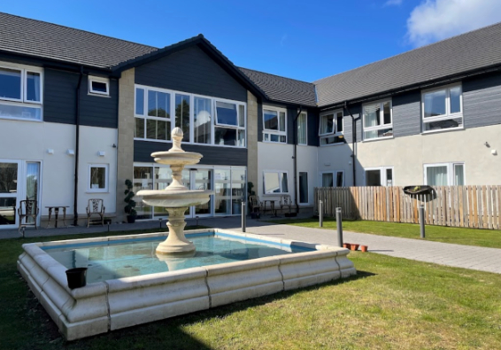 Exterior image of white house care home
