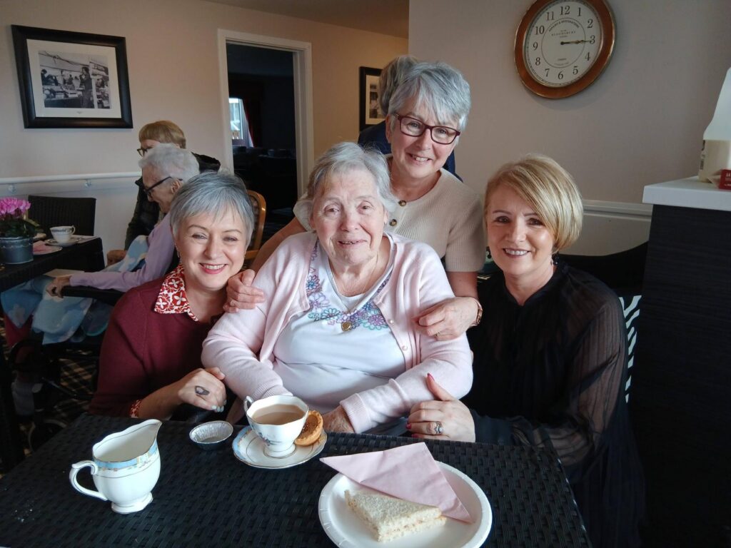 resident smiling with their family