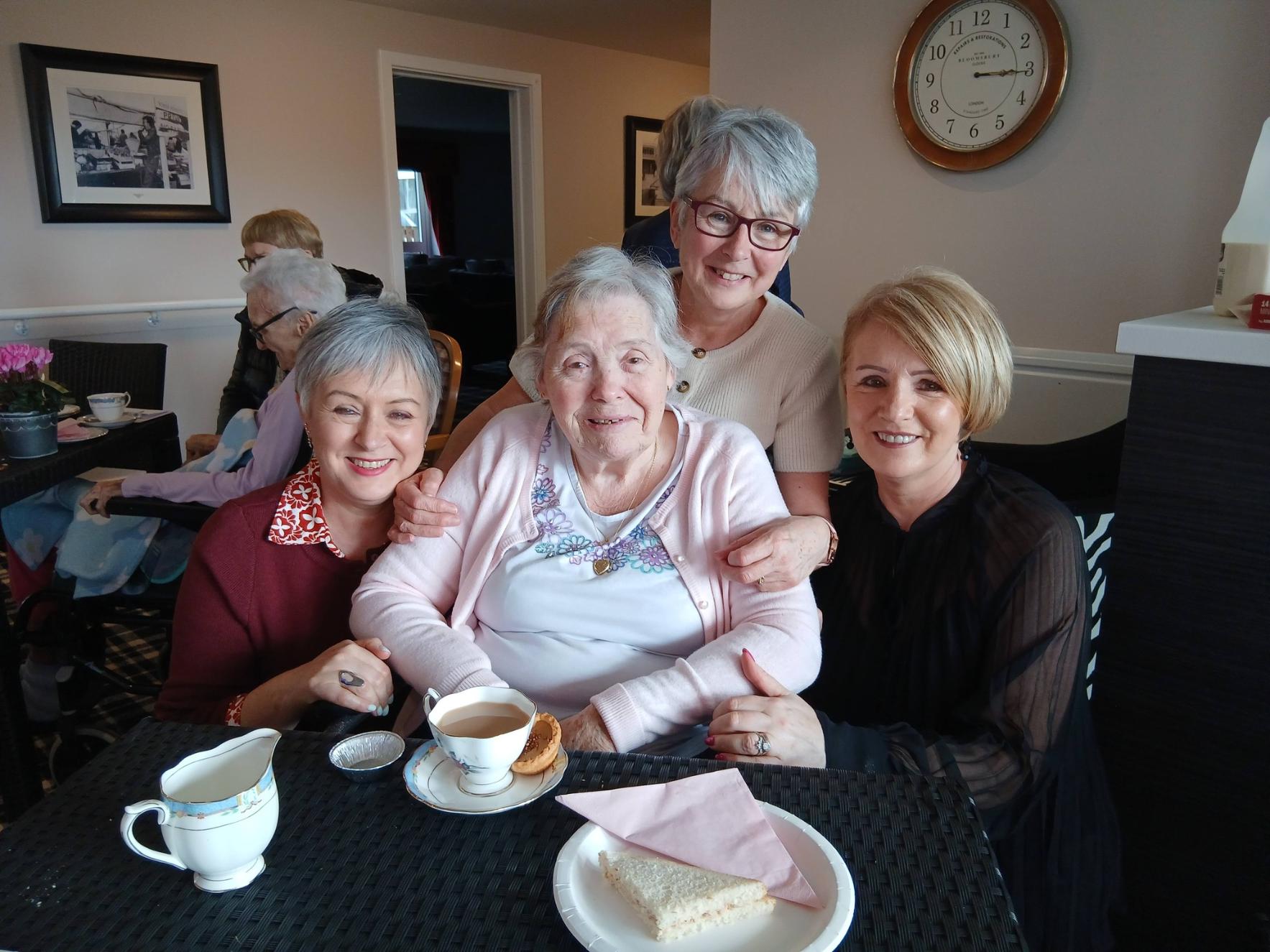 resident smiling with their family