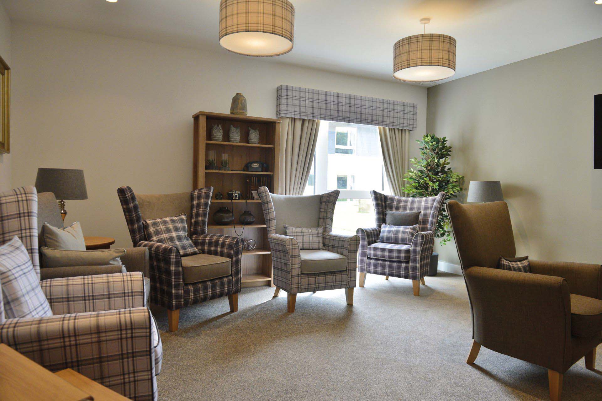gingham armchairs in care home lounge