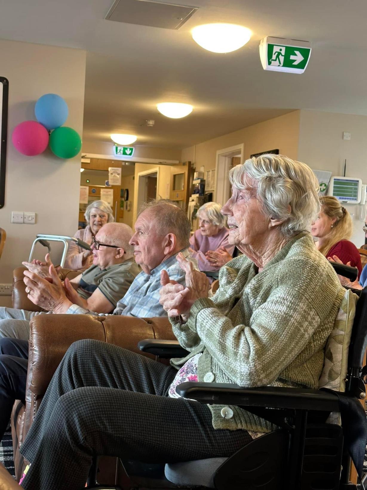 residents celebrating and watching a performance