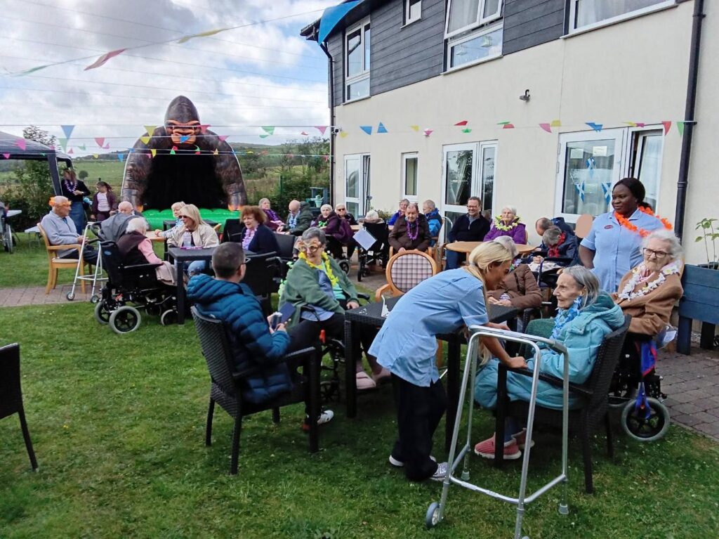 friends and family gathered at care home summer fete